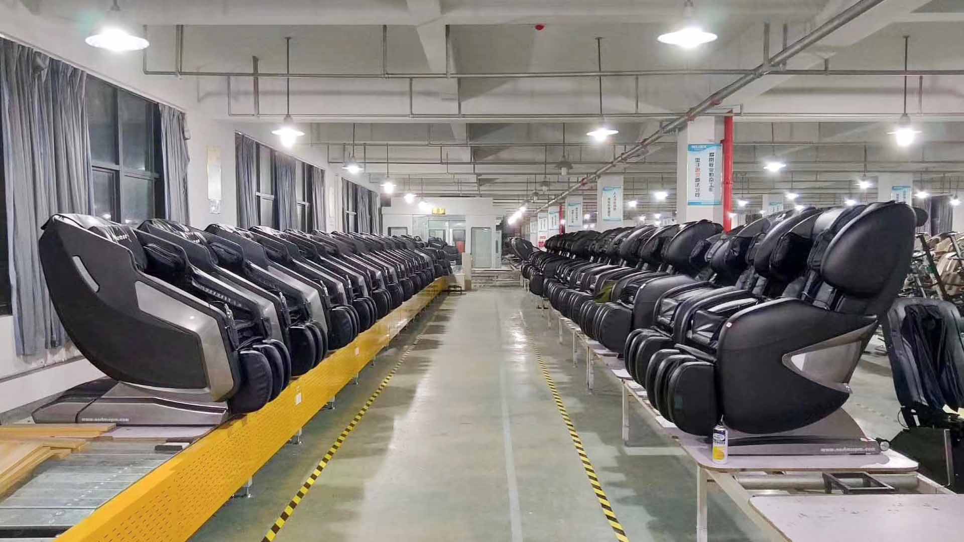 A line of massage chairs awaiting quality control and packing