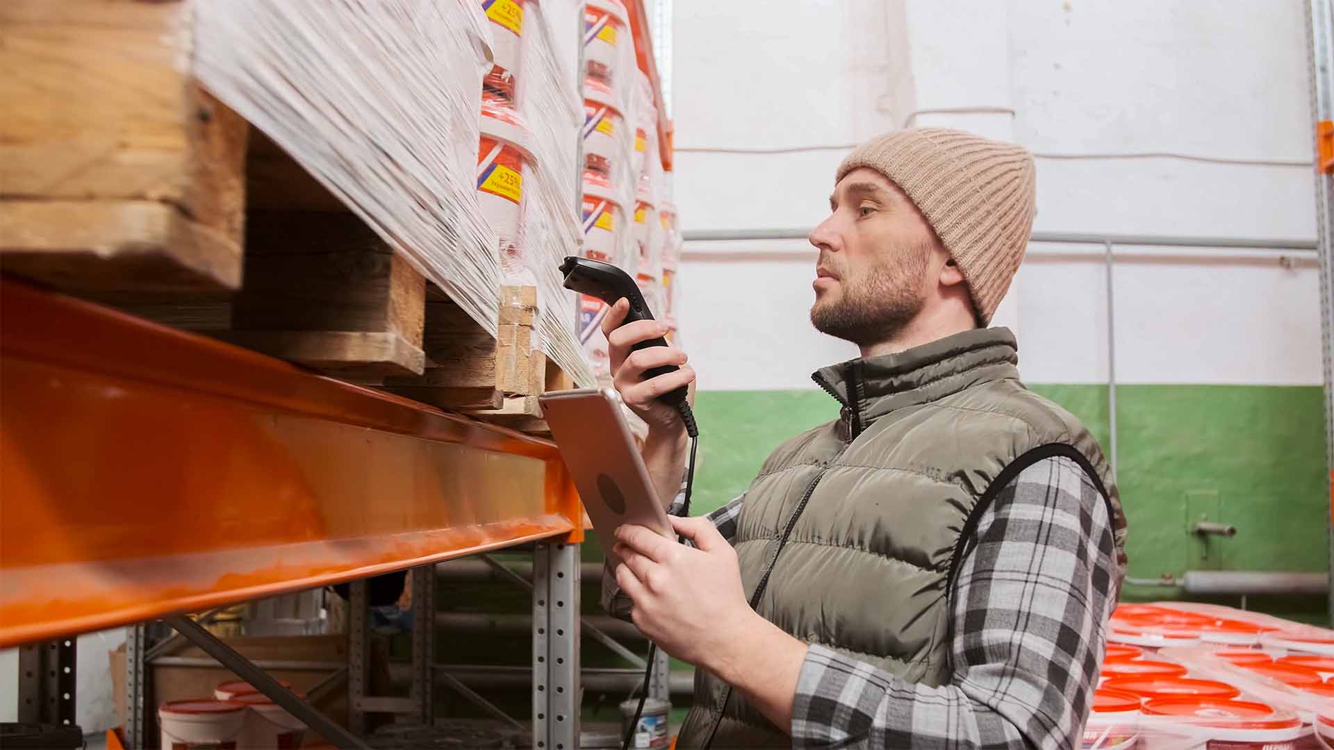 A warehouse worker scanning inventory