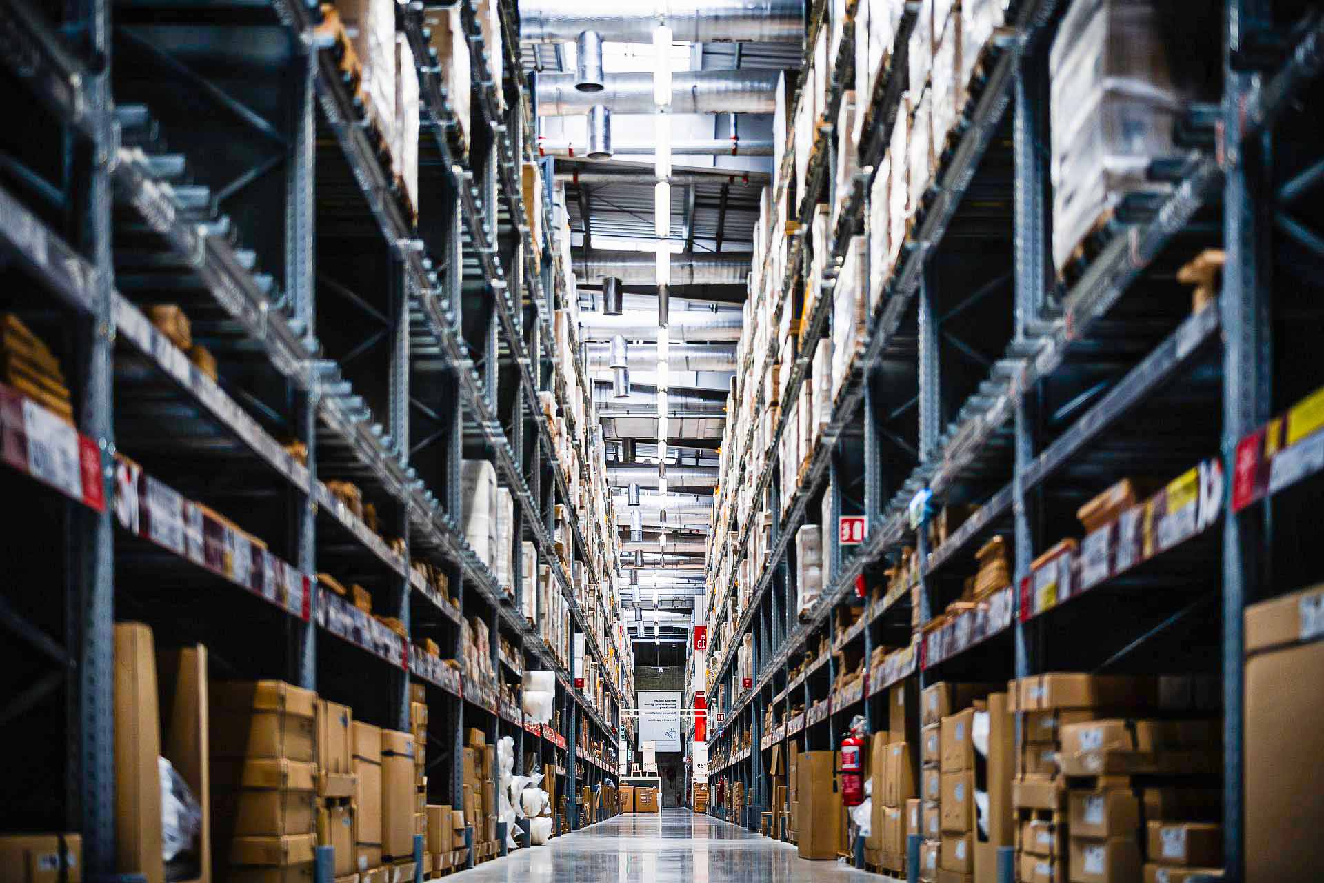 A large warehouse with aisles setup for picking activities