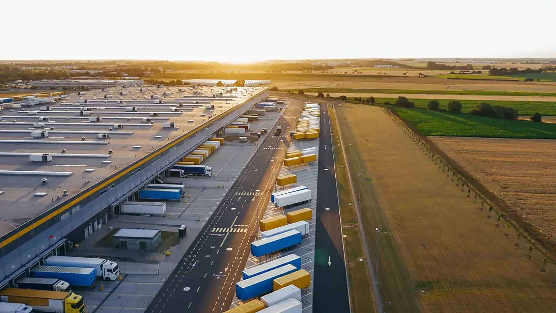 A distribution center with trucks and trailers ready for freight services