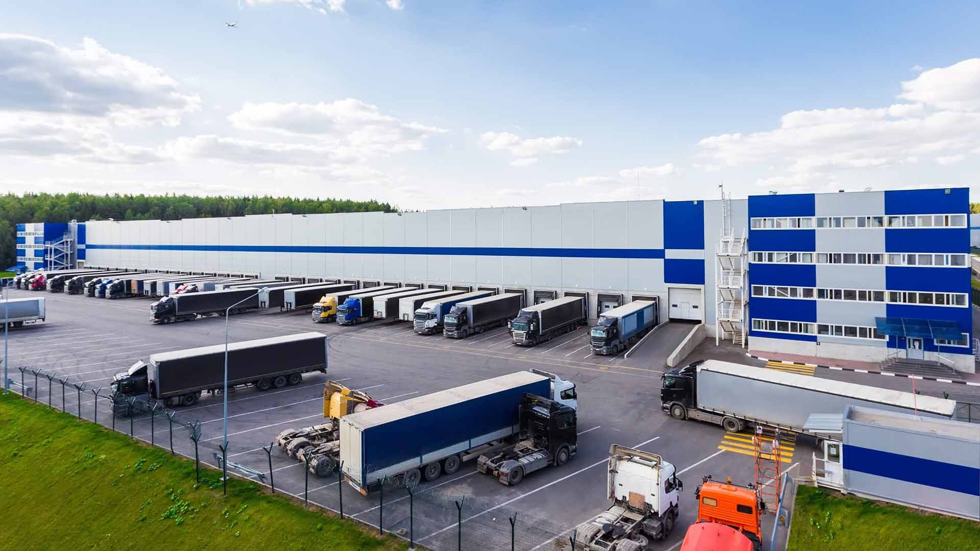 A distribution center with lots of docks and trucks
