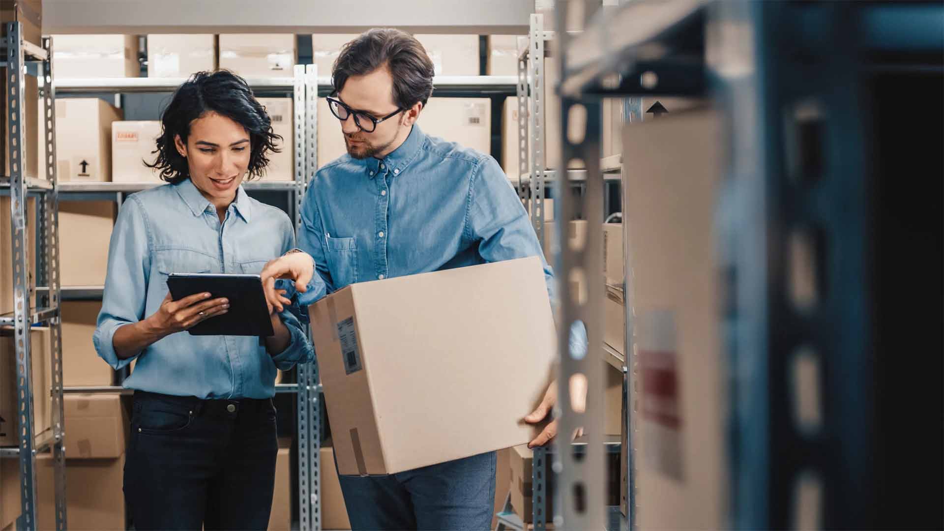 Two small business owners doing an inventory check on kitted SKUs