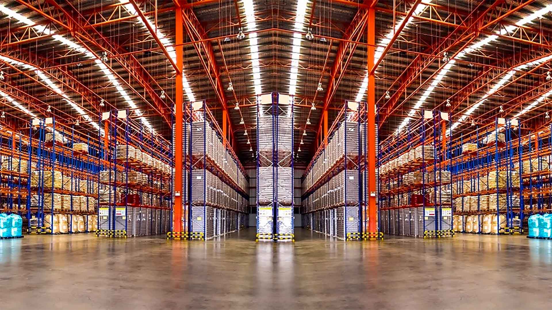 A large distribution warehouse with many pallets and racks