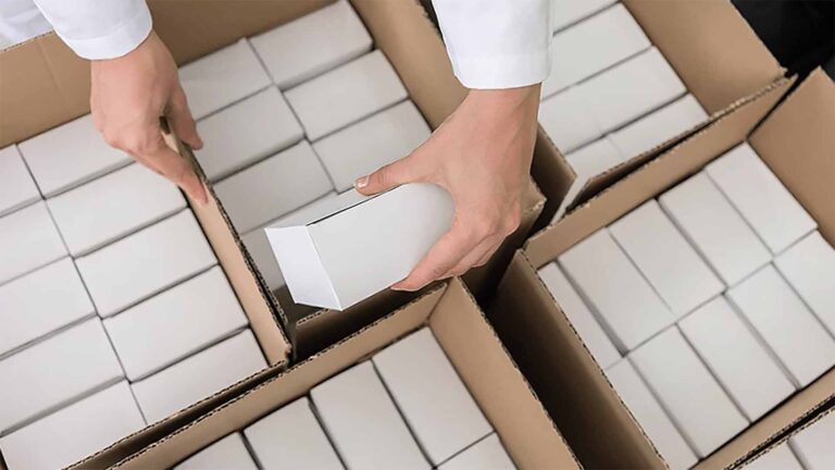 A person kitting boxes together