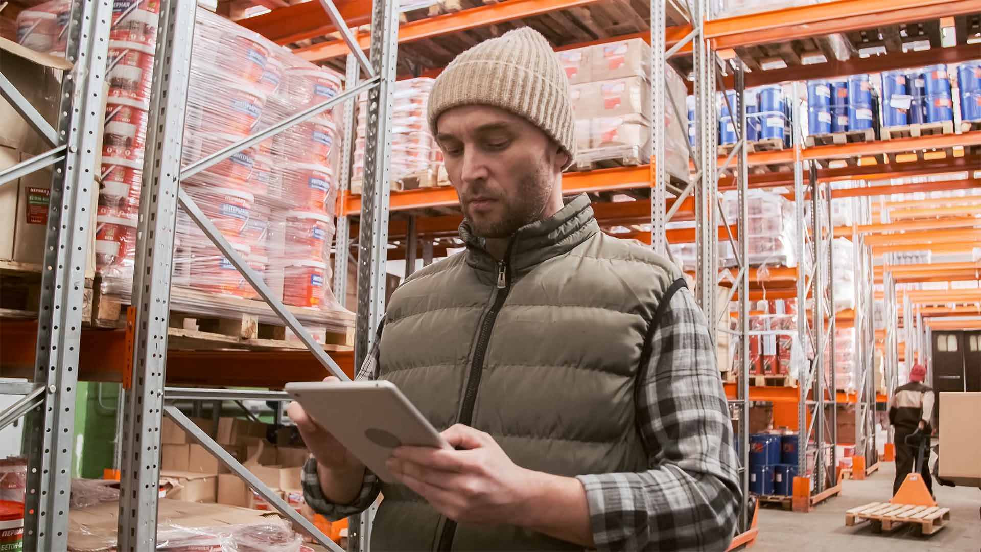 A warehouse worker using a digital pick list