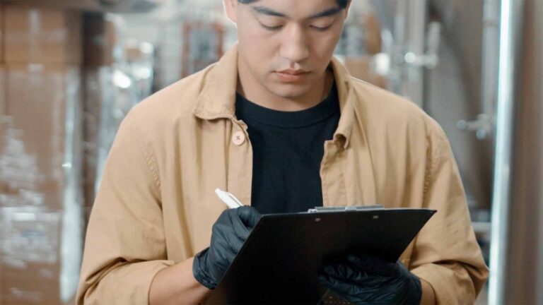 A warehouse worker using a printed pick list