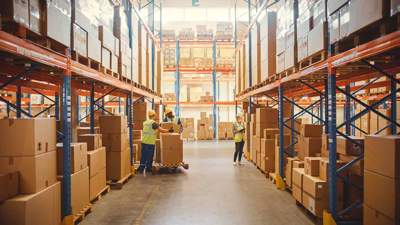 warehouse with workers and pallets