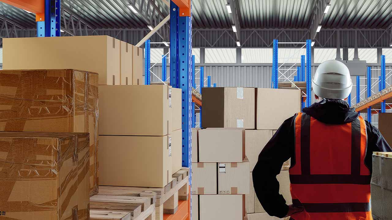 warehouse worker examining boxes