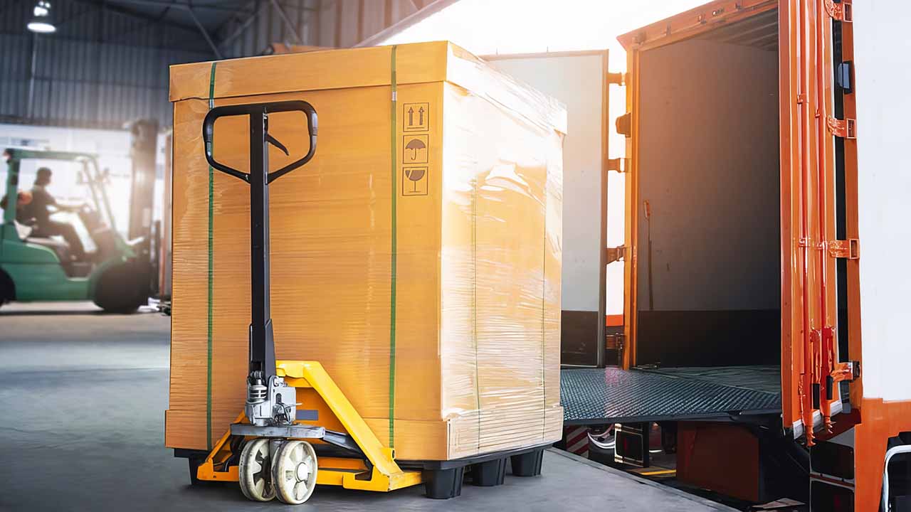 Container being unloaded from a ship at a port