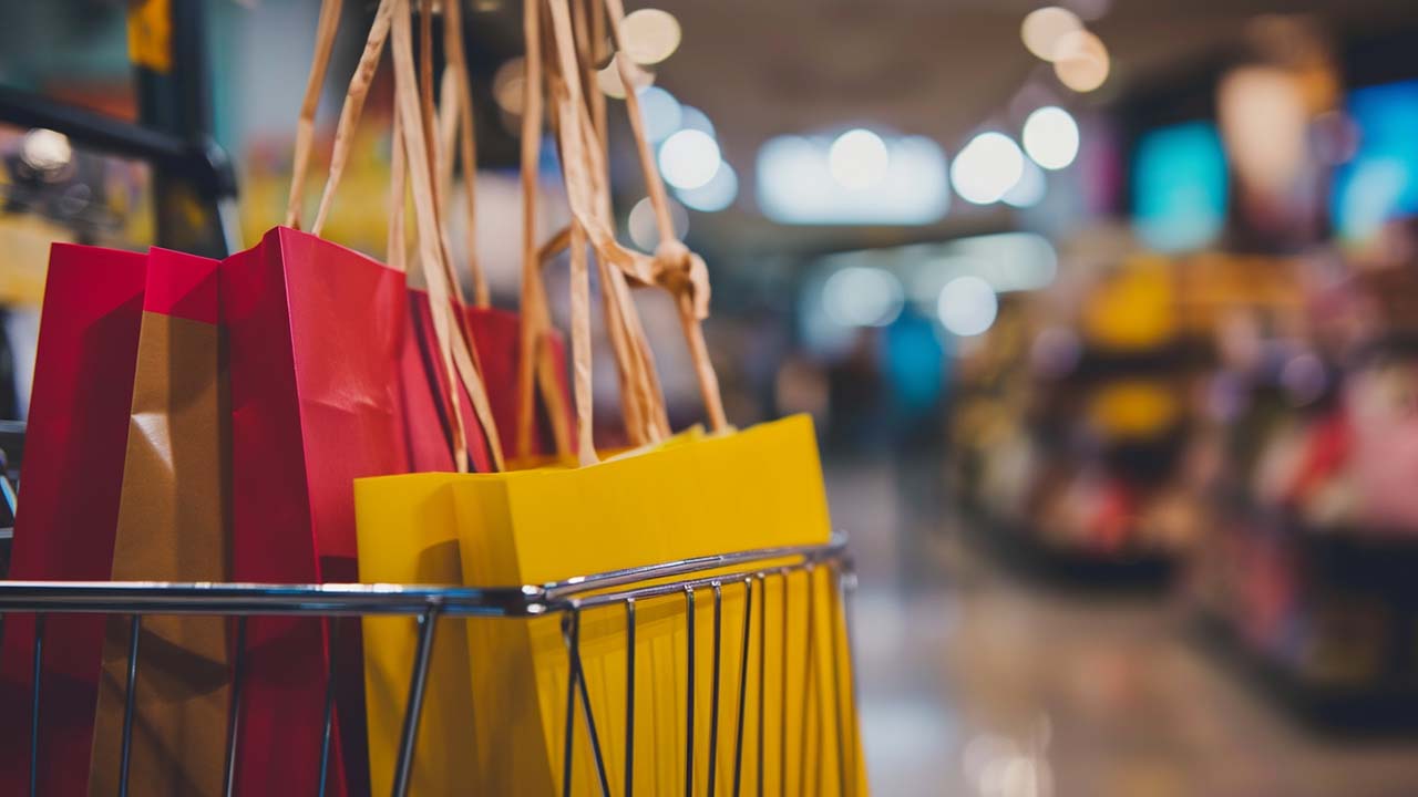 bags from retail shopping trip in a cart