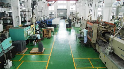 An injection molding contract manufacturing workshop with several large machines