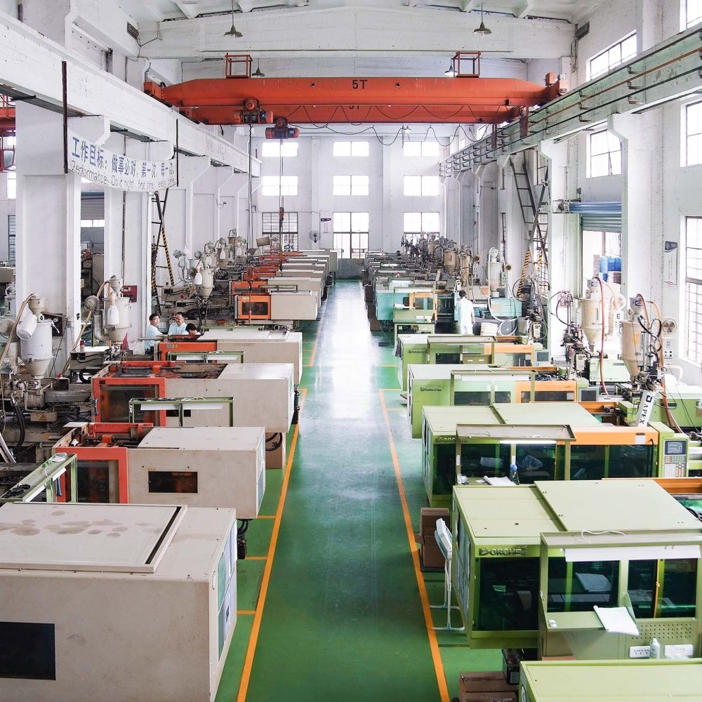 AMS Plastic Injection Injection molding workshop with several small machines